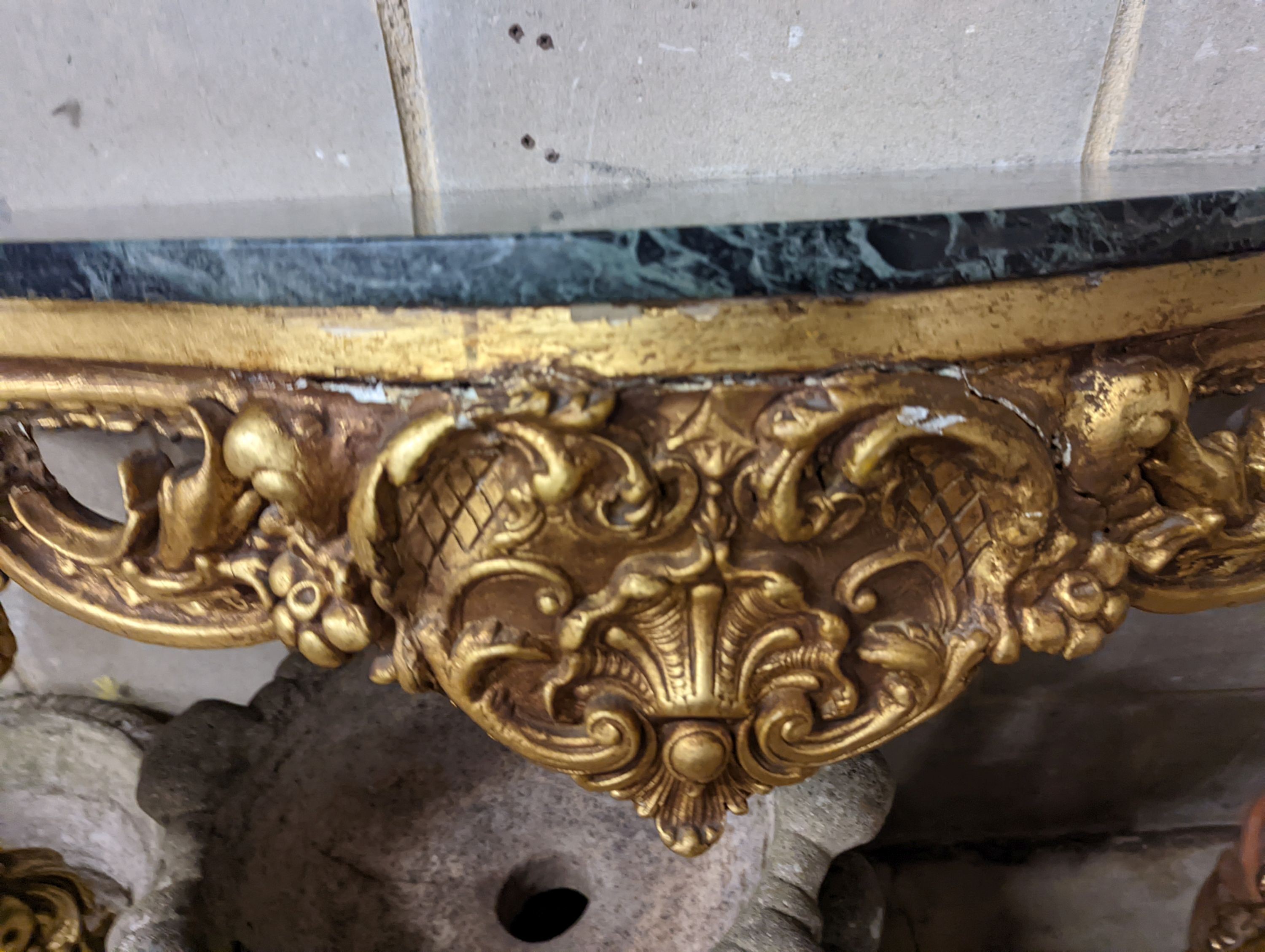 An 18th century style serpentine giltwood marble top console table, width 123cm, height 87cm